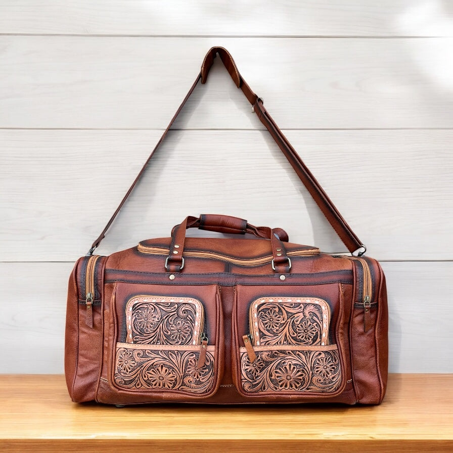 Floral tooled leather duffle bag