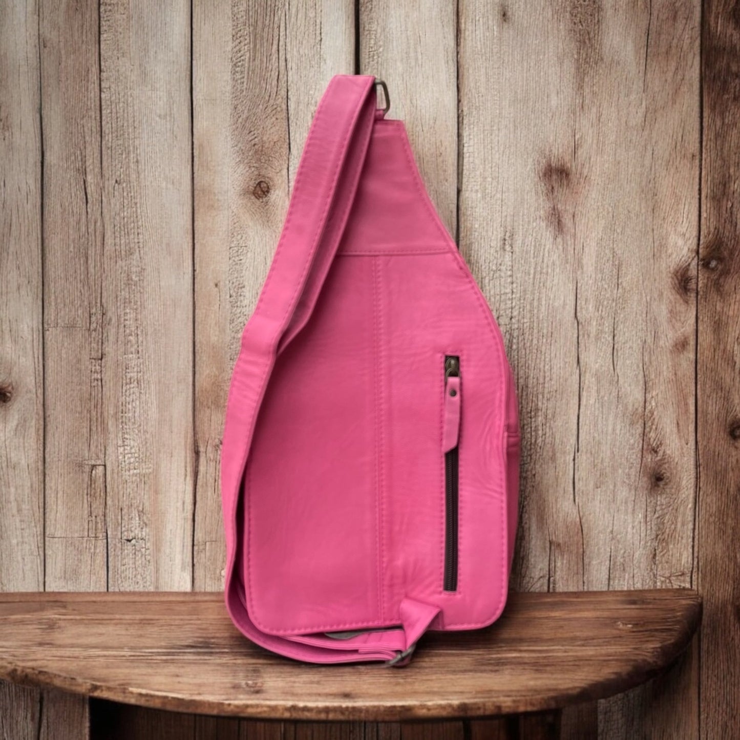 Pink cowhide/tooled sling bag