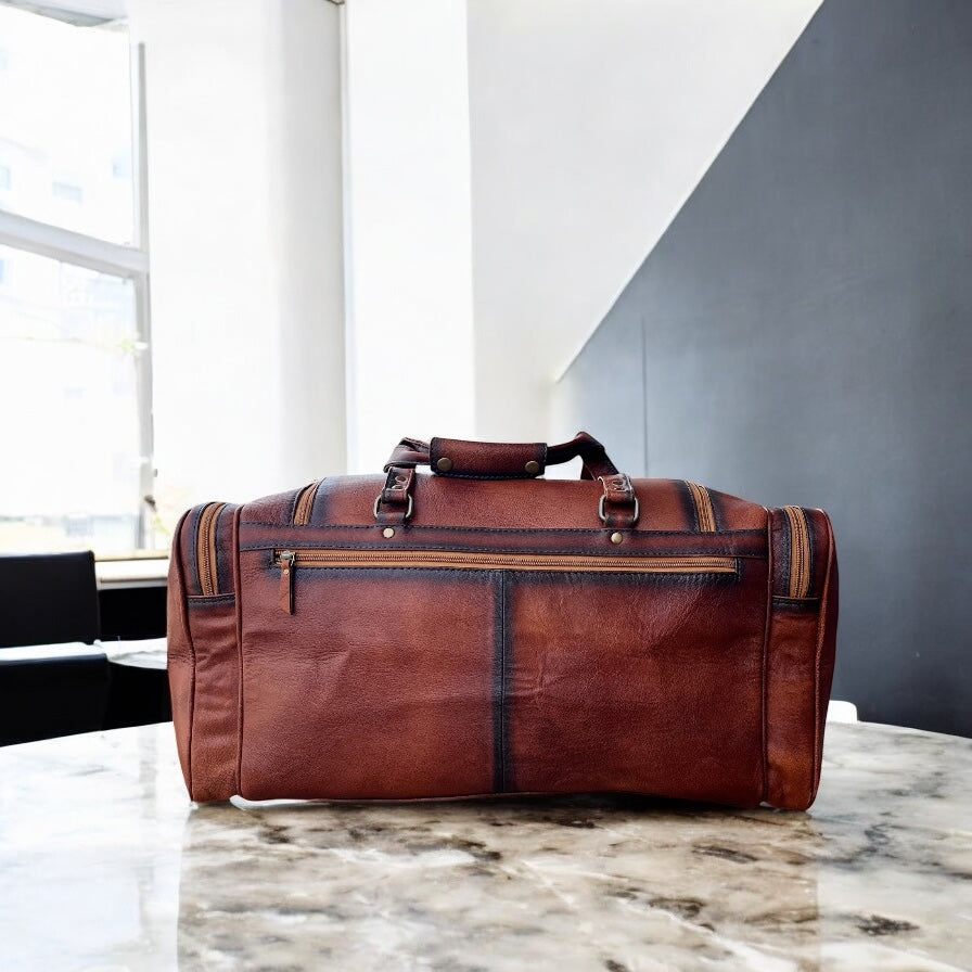 Floral tooled leather duffle bag