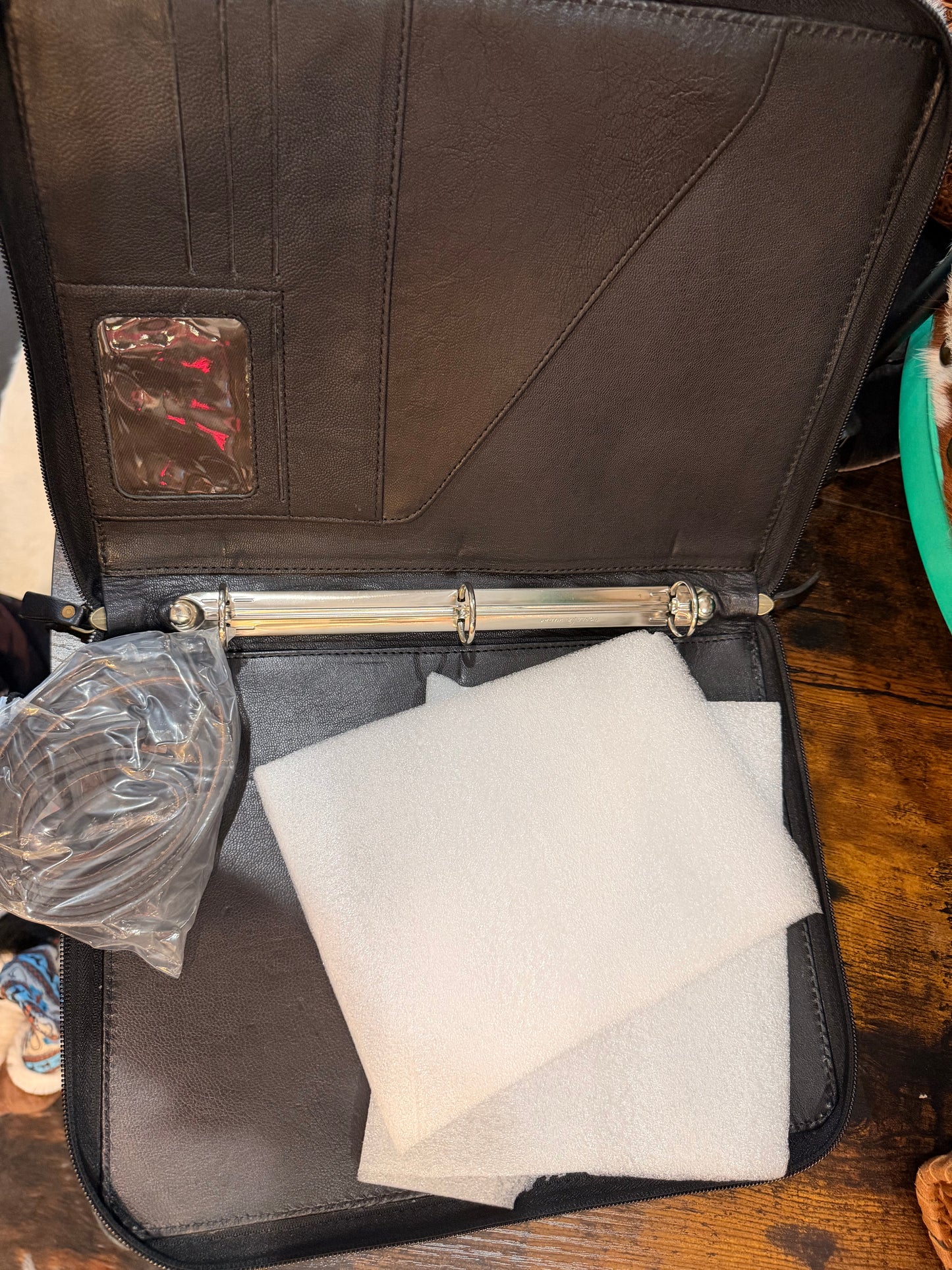 Handcrafted black tooled leather and hair-on cowhide portfolio/binder