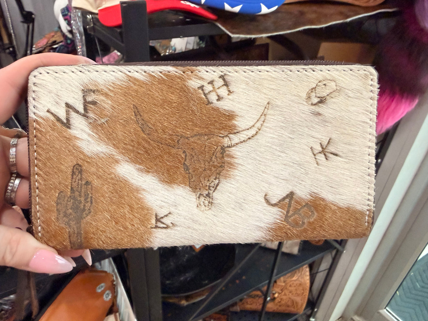 Brown and white branded wallet