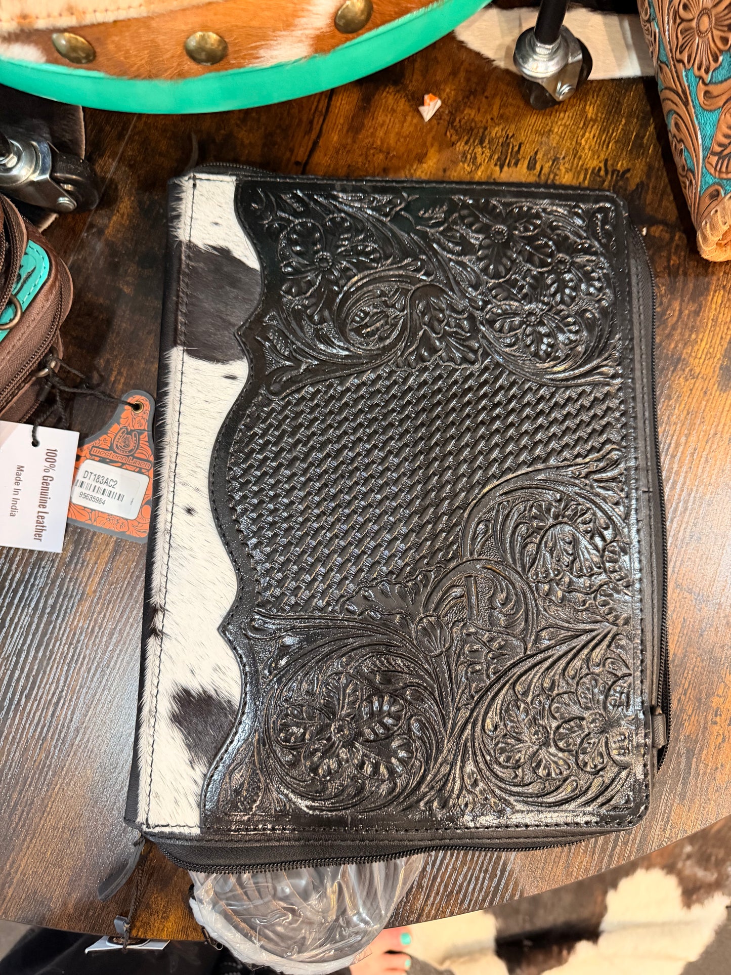 Handcrafted black tooled leather and hair-on cowhide portfolio/binder