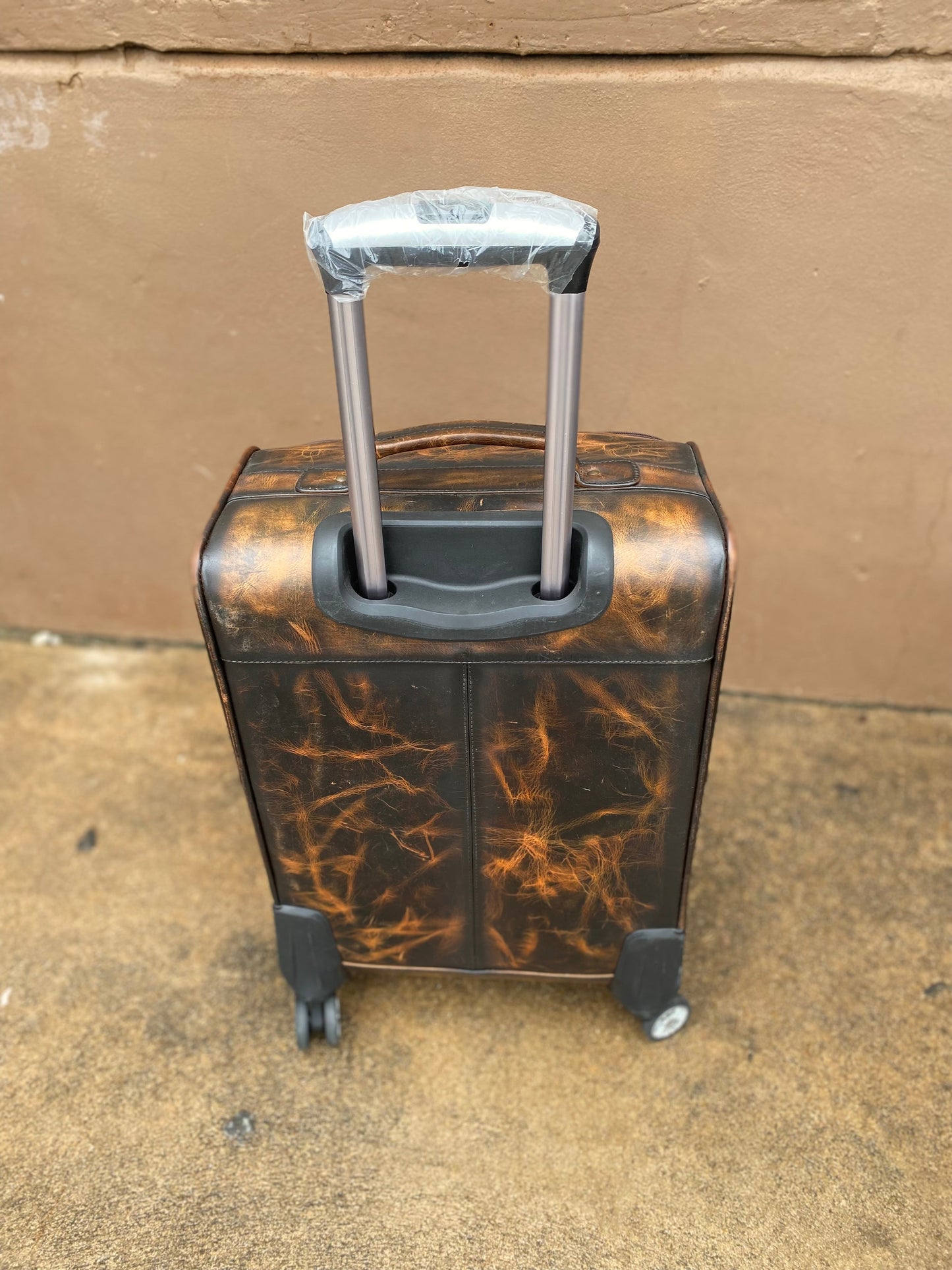 Stone Cowhide Rolling Luggage