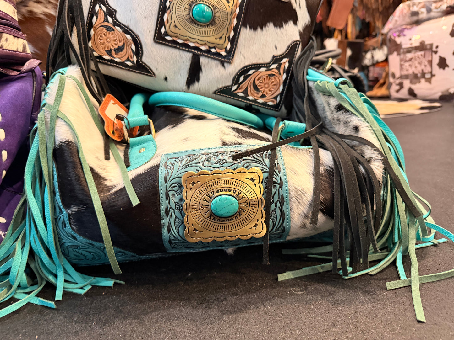 TOOLED LEATHER & COWHIDE DUFFLE BAG