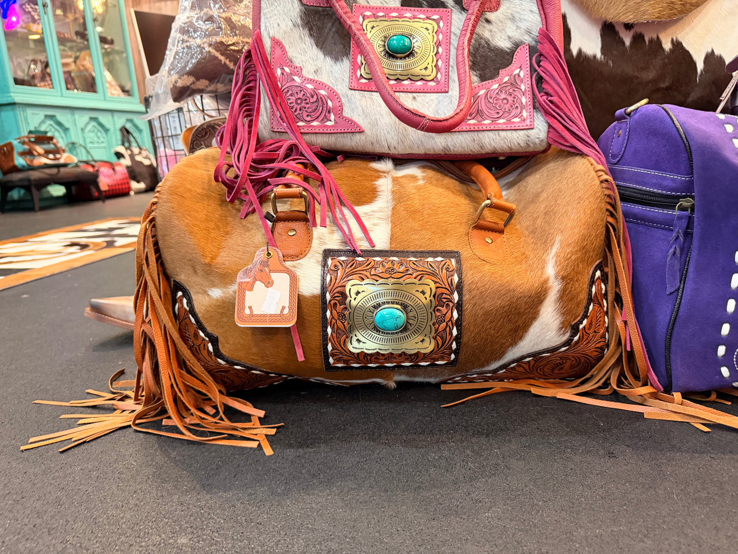 TOOLED LEATHER & COWHIDE DUFFLE BAG