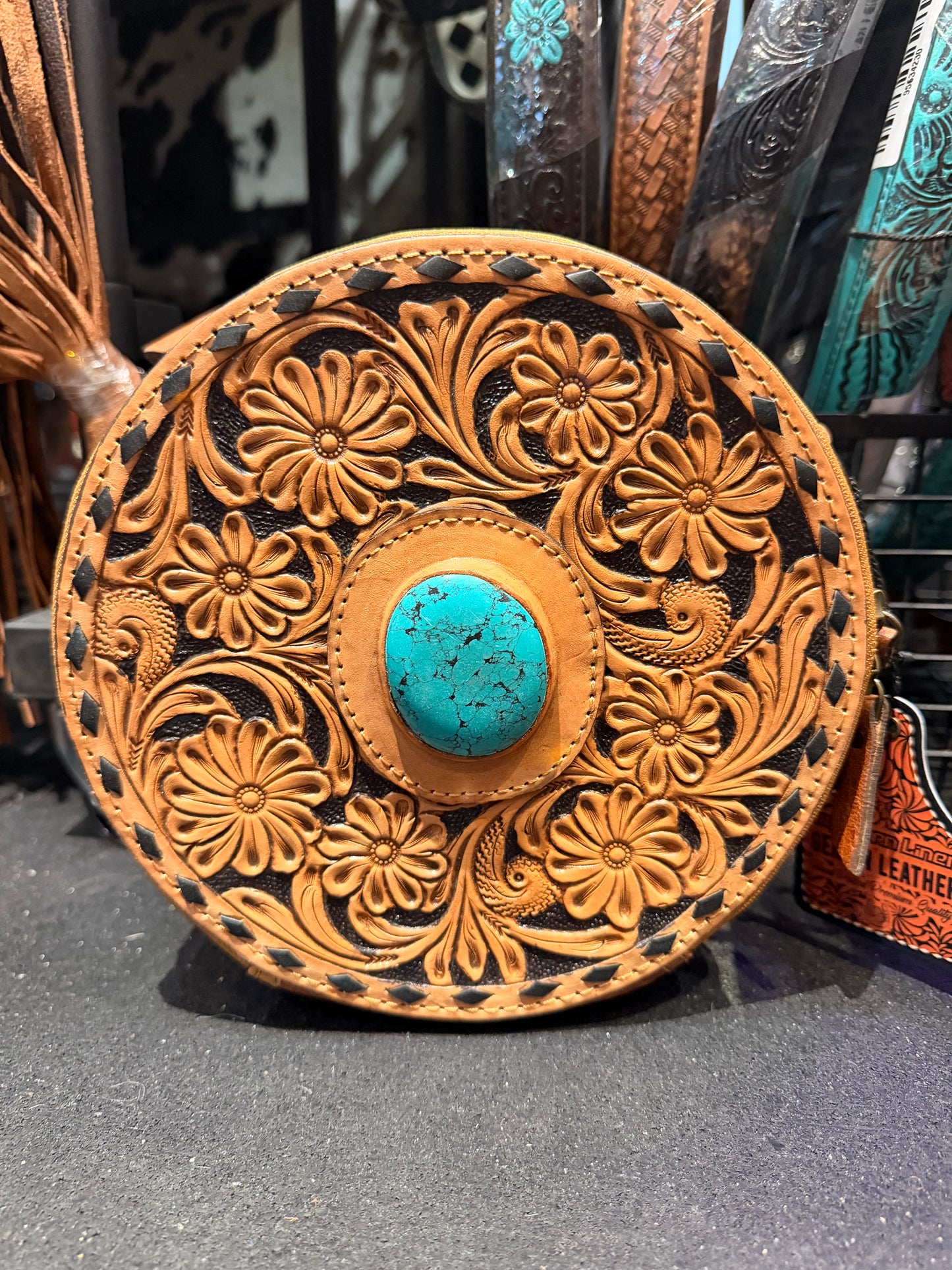 Genuine leather hand tooled and stone canteen