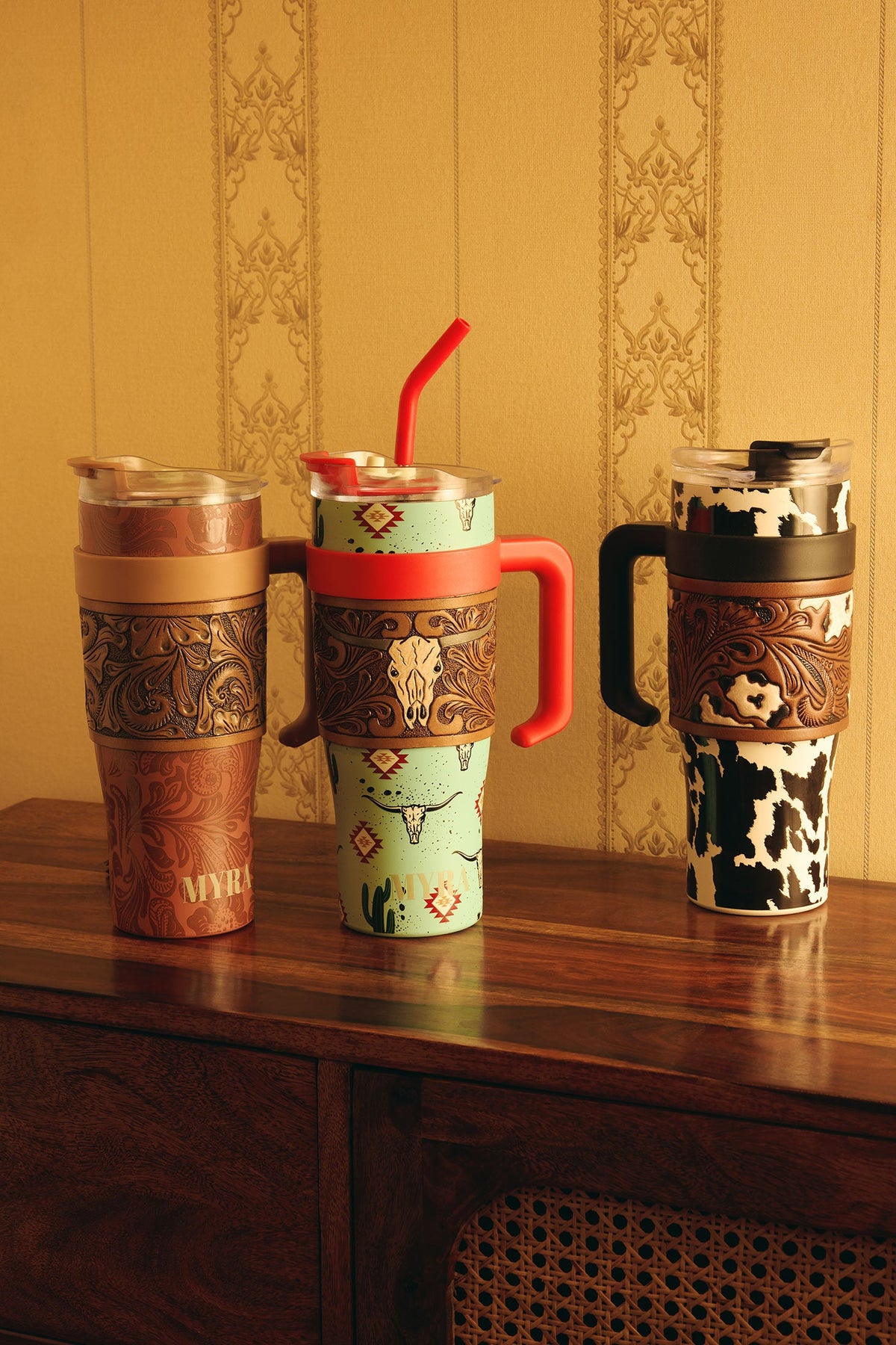 Myra Wide Wyoming Tumbler in black and white with cowhide print and tooled leather design for everyday use