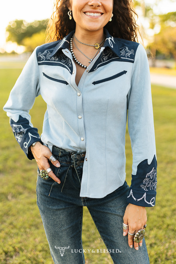 Lucky & Blessed blue and navy pearl-snap top detail